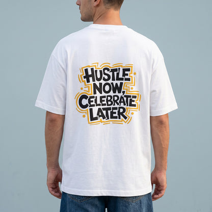 Person wearing a white t-shirt with 'Hustle Now, Celebrate Later' text on the back against a gray background