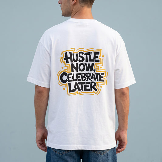 Person wearing a white t-shirt with 'Hustle Now, Celebrate Later' text on the back against a gray background